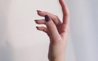 persons left hand on white wall